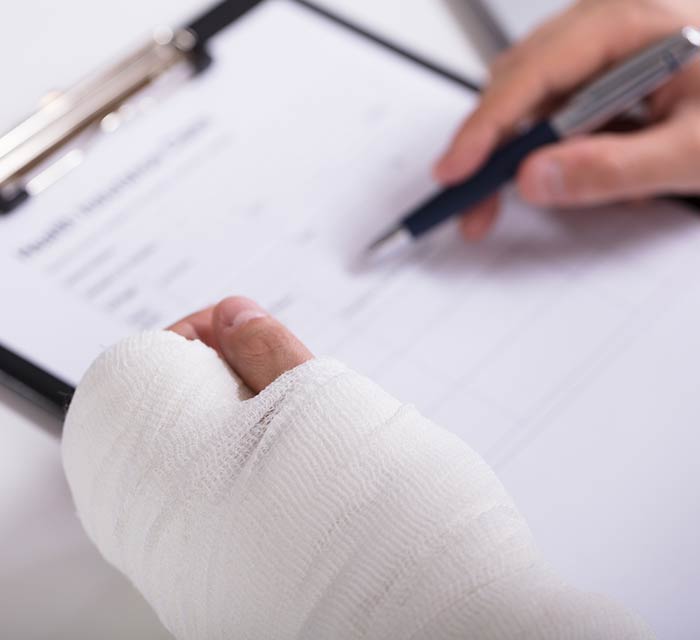Injured employee filling-out workers compensation claim.